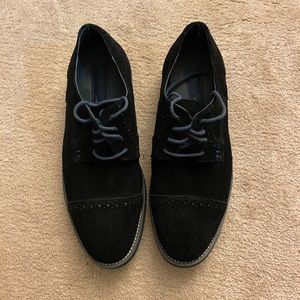 Men’s black and blue shade shoes.